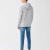 Soft grey pocket hoodie made from organic cotton blend, featuring ribbed cuffs and front pocket stitching detail