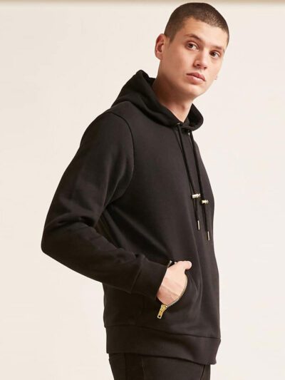 Soft black hoodie with gold zipper pocket, ribbed cuffs, and kangaroo front pocket
