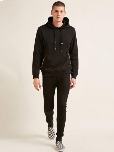Soft black hoodie with gold zipper pocket, ribbed cuffs, and kangaroo front pouch