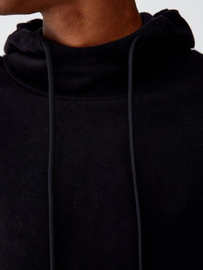 Black and white hoodie with side stripes, made of premium cotton blend, ribbed cuffs, and kangaroo pocket