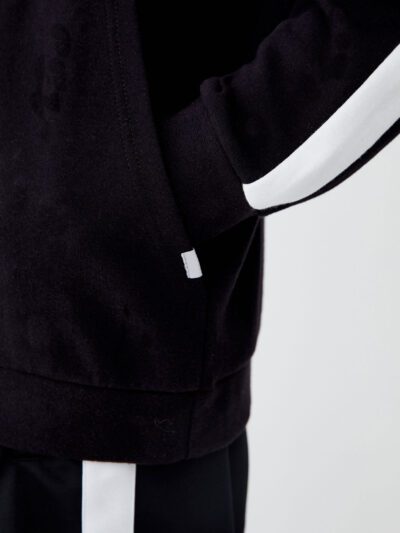 Black and white hoodie with side stripes, made of premium cotton blend, featuring ribbed cuffs and front kangaroo pocket