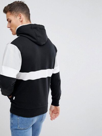 Vintage-style black pullover hoodie with half zipper, showcasing retro design elements and durable stitching