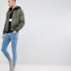 Soft black half-zip retro hoodie in heavyweight cotton with ribbed cuffs and front pouch pocket