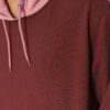 Modern two-tone pullover hoodie with contrasting hood lining, textured fabric, and detailed stitching