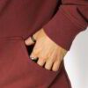 Soft pullover hoodie in contrasting colors with kangaroo pocket and ribbed cuffs