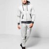 Deep navy custom embroidered tracksuits with white detailing, showcasing premium stitching, soft velvety texture and snug fit