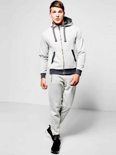 Deep navy custom embroidered tracksuits with white detailing, showcasing premium stitching, soft velvety texture and snug fit
