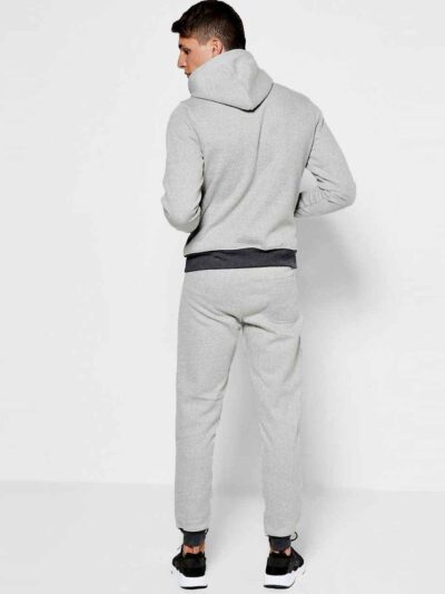 Deep navy custom embroidered tracksuits with white detailing, showcasing premium stitching, soft velvety texture and snug fit