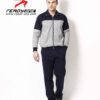 Close-up of a bespoke tracksuit. Fine stitching on navy fabric, showcasing a subtle sheen and comfortable, relaxed fit. Ideal