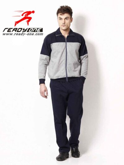 Close-up of a bespoke tracksuit. Fine stitching on navy fabric, showcasing a subtle sheen and comfortable, relaxed fit. Ideal