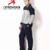 Close-up of a bespoke tracksuit. Fine stitching on navy fabric, showcasing a subtle sheen and comfortable, relaxed fit. Ideal