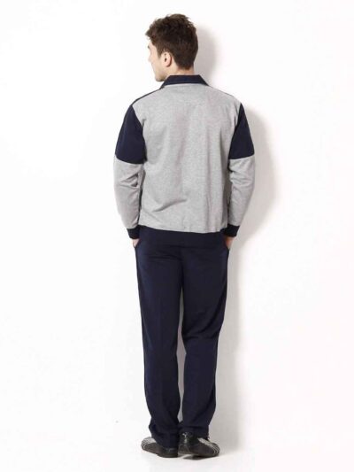 Close-up of a bespoke tracksuit. Fine stitching on navy fabric, showcasing a subtle sheen and comfortable, relaxed fit. Ideal