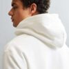 Soft fleece custom hoodie in versatile grey with front pouch pocket and durable stitching