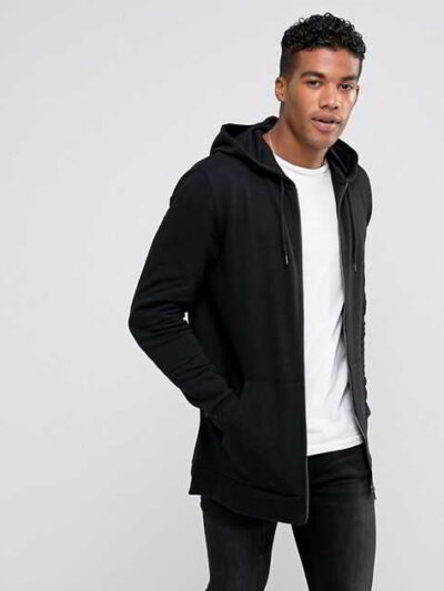 Black zip-up hoodie with custom logo option. Soft, textured fabric. Longline fit. Quality stitching detail evident. Perfect f