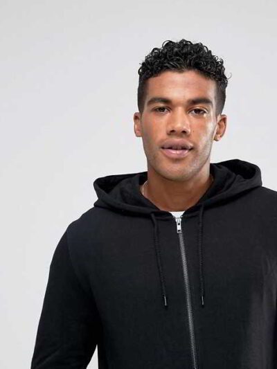 Black zip-up hoodie with custom logo option. Soft, textured fabric. Longline fit. Quality stitching detail evident. Perfect f