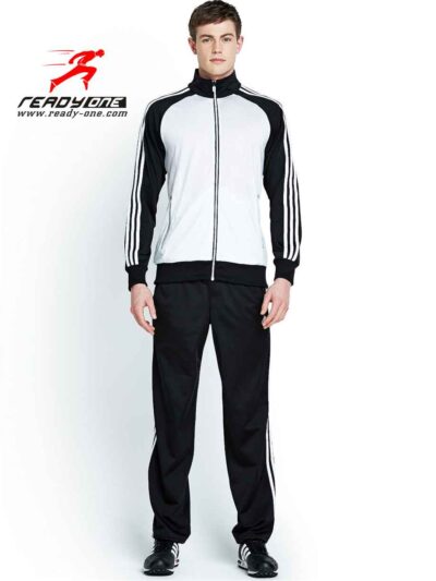 Streetwear tracksuit featuring bespoke logo embroidery. Heather grey, ribbed cuffs, premium cotton blend with subtle textured