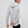 Slate grey, longline hoodie with a distinctive curved hem, exhibiting a soft, fine-textured fabric and well-crafted stitching