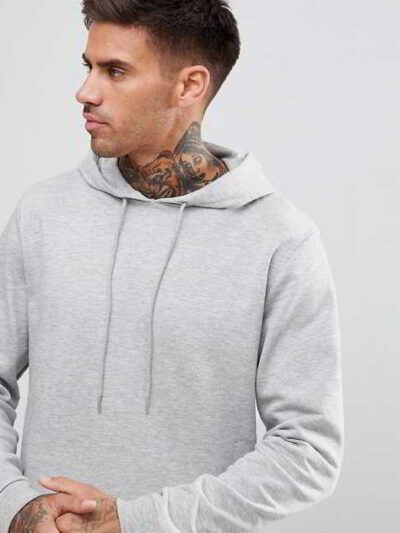 Slate grey, longline hoodie with a distinctive curved hem, exhibiting a soft, fine-textured fabric and well-crafted stitching