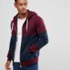 Maroon custom panel zip hoodie with contrasting fabric textures and intricate stitching details