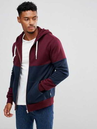 Maroon custom panel zip hoodie with contrasting fabric textures and intricate stitching details