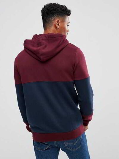 Maroon panel zip hoodie with intricate stitching details and soft fabric texture