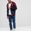 Modern maroon zip hoodie with unique panel design, soft fabric texture, and precise stitching details