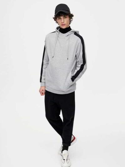 High-quality, striped logo hoodies in various colors, exhibiting meticulous stitching and soft, plush fabric texture.