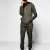 Ribbed biker tracksuit in soft cotton. Close-up shows textured fabric, reinforced stitching, and customizable panels. Premium