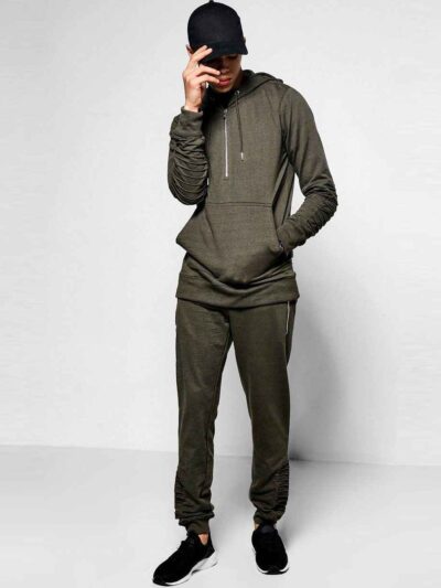 Ribbed biker tracksuit in soft cotton. Close-up shows textured fabric, reinforced stitching, and customizable panels. Premium