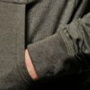 Ribbed biker tracksuit in soft cotton. Close-up shows textured fabric, reinforced stitching, and customizable panels. Premium