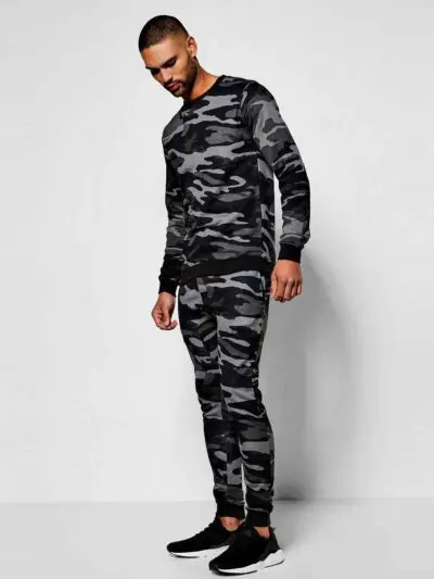 Green camo tracksuit: soft, brushed fabric, neat stitching. Relaxed fit hoodie and joggers. Modern streetwear for clothing br