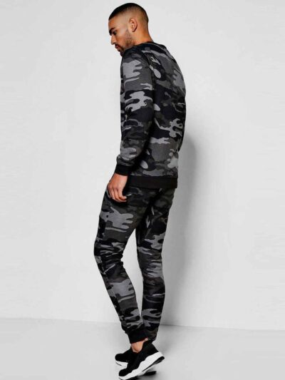 Green camo tracksuit: soft, brushed fabric, neat stitching. Relaxed fit hoodie and joggers. Modern streetwear for clothing br