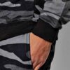 Green camo tracksuit: soft, brushed fabric, neat stitching. Relaxed fit hoodie and joggers. Modern streetwear for clothing br