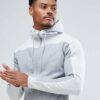 Heavyweight black cotton hoodie with front kangaroo pocket and ribbed cuffs