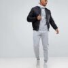 Heavyweight black cotton hoodie with kangaroo pocket and ribbed cuffs