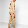 Biker-style tracksuit. Premium knit, visible stitching. Luxury sportswear: dark heather grey jacket, black bottoms. Sporty, c