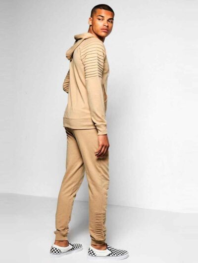 Biker-style tracksuit. Premium knit, visible stitching. Luxury sportswear: dark heather grey jacket, black bottoms. Sporty, c