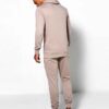 Skinny tracksuit set showing fine stitching. Close-up reveals a soft, textured knit fabric in a subtle heather gray with slim