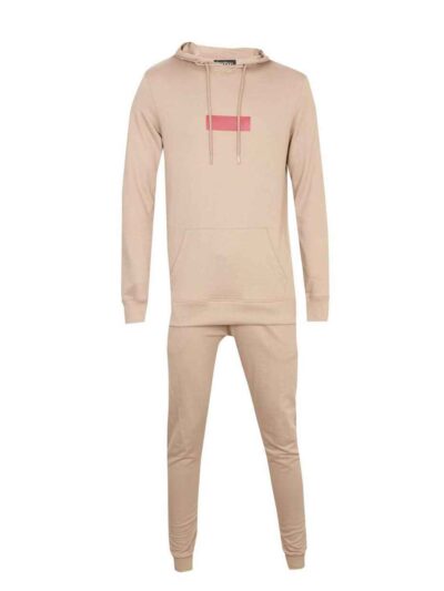 Skinny tracksuit set showing fine stitching. Close-up reveals a soft, textured knit fabric in a subtle heather gray with slim