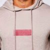 Skinny tracksuit set showing fine stitching. Close-up reveals a soft, textured knit fabric in a subtle heather gray with slim