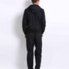 Stylish streetwear tracksuit, close-up shows durable stitching, ribbed cuffs, and soft fabric texture. Two-piece set with sub