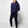 Ribbed knit tracksuit in charcoal gray. Streetwear style, paneled design, athletic fit. Notice the distinct ribbing texture a