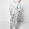 Ribbed knit tracksuit in charcoal gray. Streetwear style, paneled design, athletic fit. Notice the distinct ribbing texture a