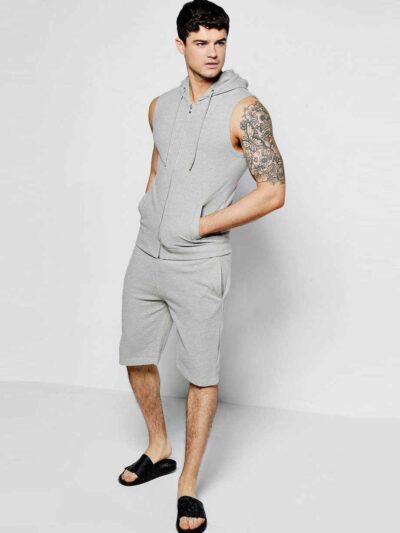 Sleeveless hooded tracksuit, close-up on soft knit fabric, detailed stitching. Activewear set in gradient blues, ideal for gy