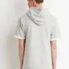 Premium short sleeve streetwear hoodie with a vibrant, shimmery fabric texture, visible high-quality stitching, and a sleek,