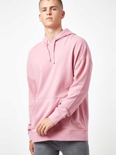 Light pink, oversized drop shoulder hoodie, with visible soft, fleece-like inner fabric, and robust double stitching.
