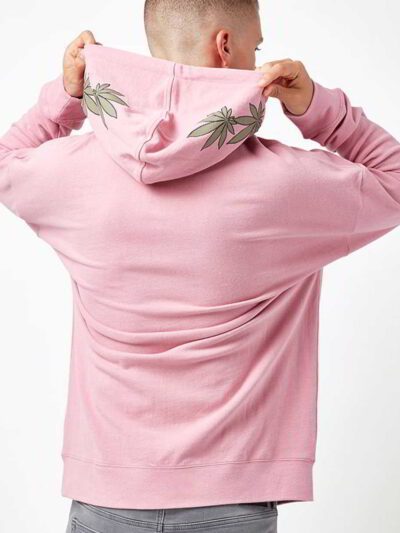 Light pink oversized hoodie with drop shoulders, showcasing a soft, plush fabric texture, meticulous stitching, and a versati