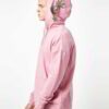 Light pink oversized hoodie with drop shoulder design. Soft cotton blend fabric, high-quality stitching, perfect for a laid-b