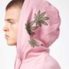 Light pink oversized hoodie featuring drop shoulder design, smooth fabric texture, and meticulous stitching.