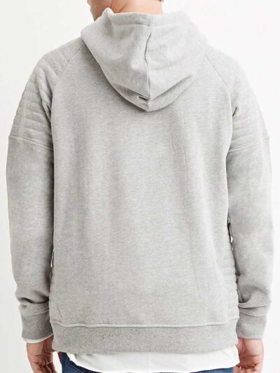 Close-up of a textured charcoal grey biker hoodie. Heavy stitching, oversized hood, and comfortable pullover style visible. Q